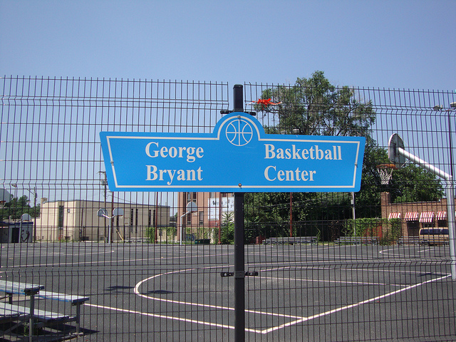 Basketball court with sign saying George Bryant Basketball Center Basketball court with sign saying George Bryant Basketball Center